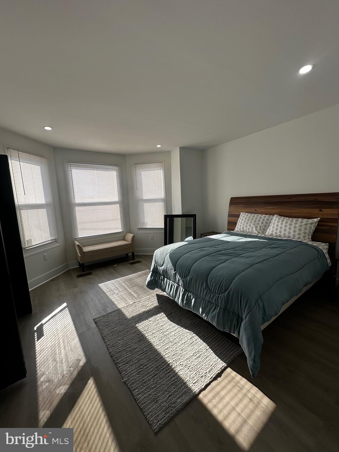 263 South 58th Street Philadelphia, PA 19139 - Photo 17 of 25 a bedroom with a bed next to a window with outer view