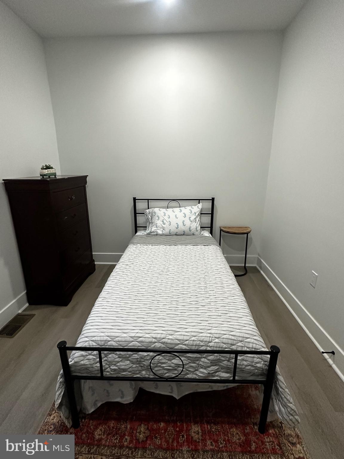 263 South 58th Street Philadelphia, PA 19139 - Photo 21 of 25 a bed sitting in a bedroom next to a window