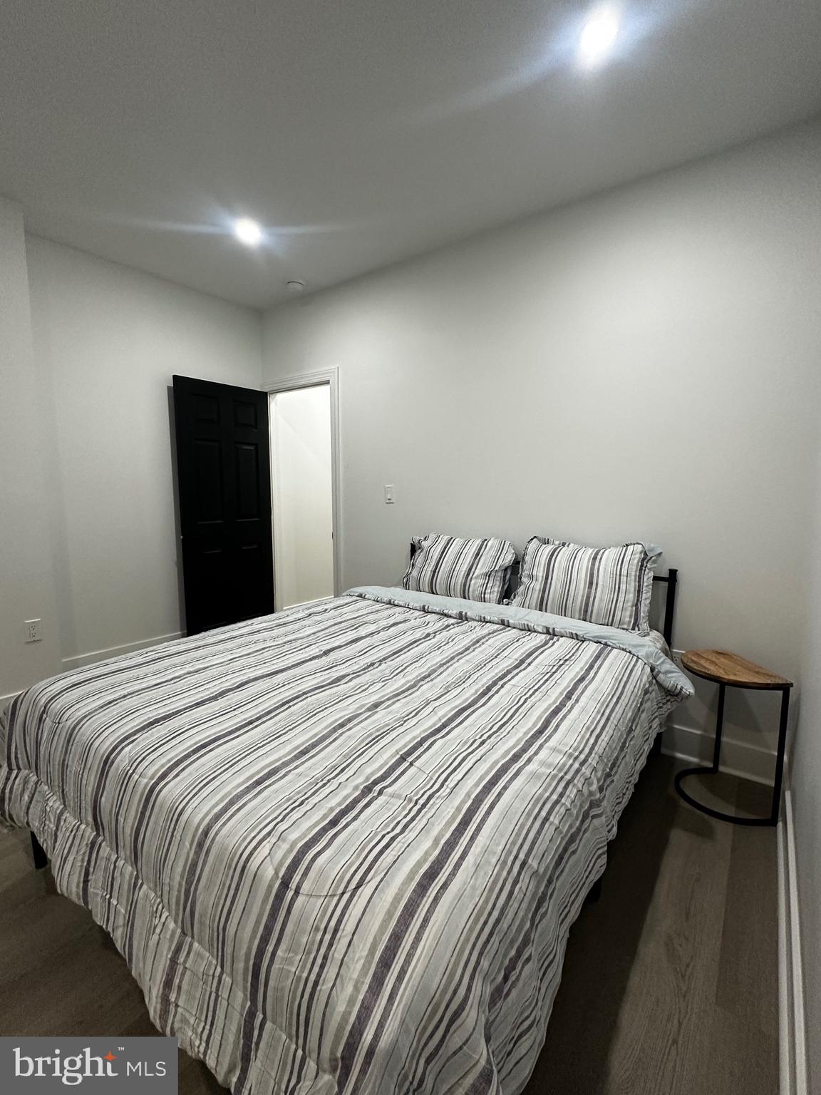 263 South 58th Street Philadelphia, PA 19139 - Photo 23 of 25 a bedroom with a bed and a mirror