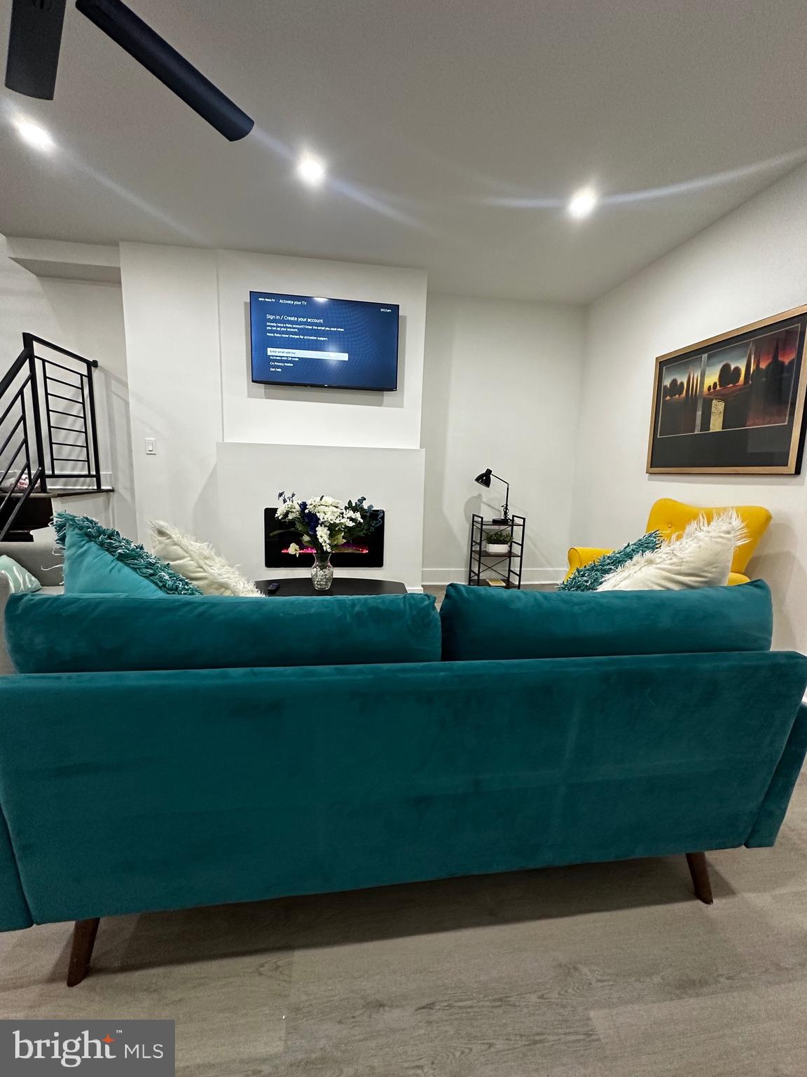 263 South 58th Street Philadelphia, PA 19139 - Photo 5 of 25 a living room with furniture and a flat screen tv