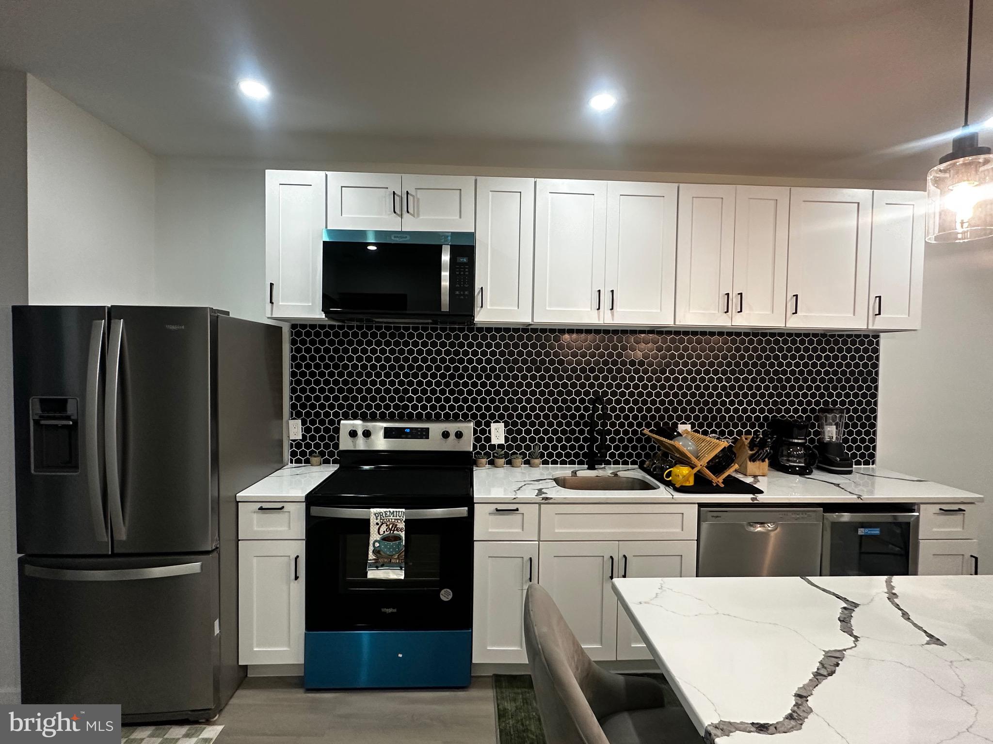 263 South 58th Street Philadelphia, PA 19139 - Photo 10 of 25 a kitchen with a sink and stainless steel appliances