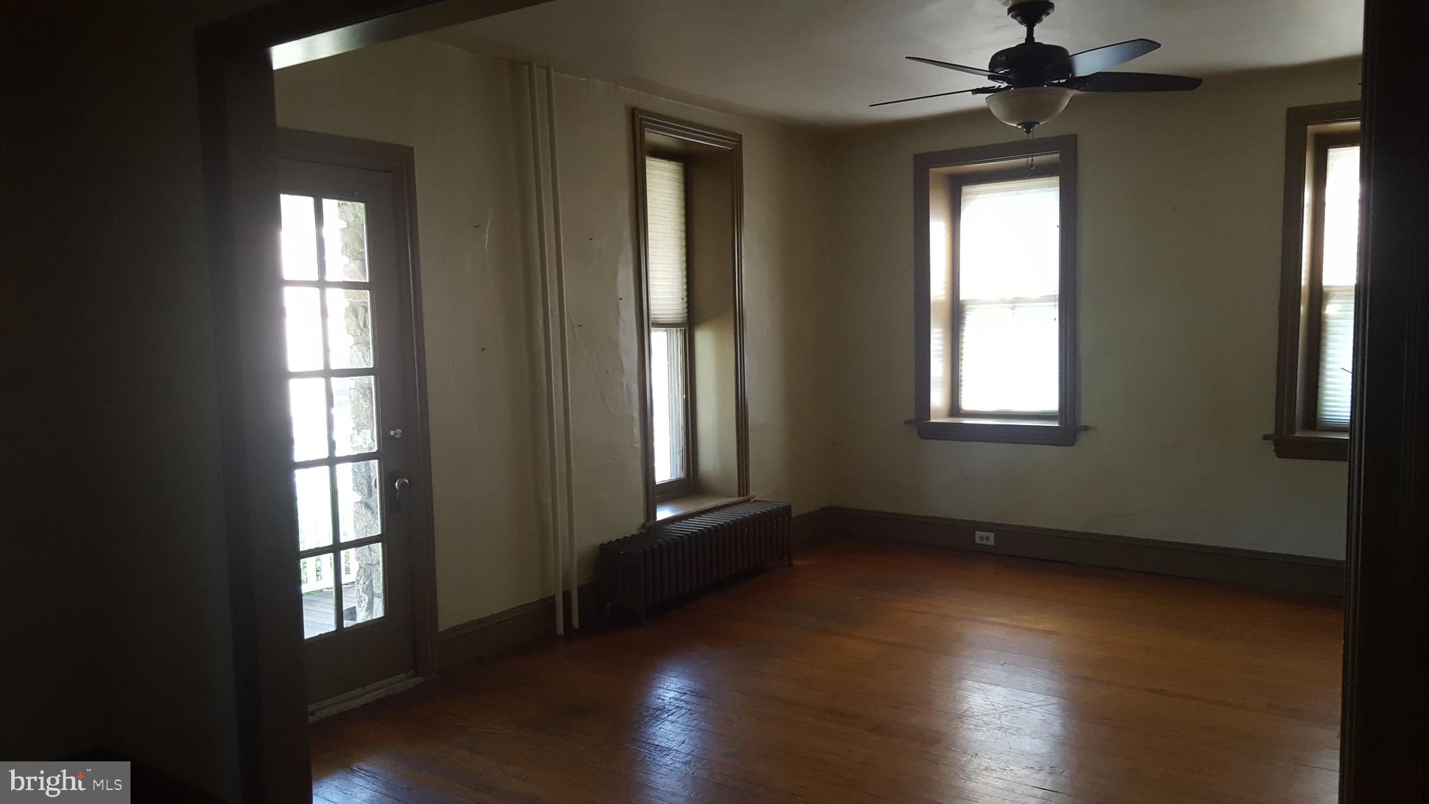 2902 Lower Saucon Road, Unit A&B Hellertown, PA 18055 - Photo 14 of 53 a view of an empty room with wooden floor and a window