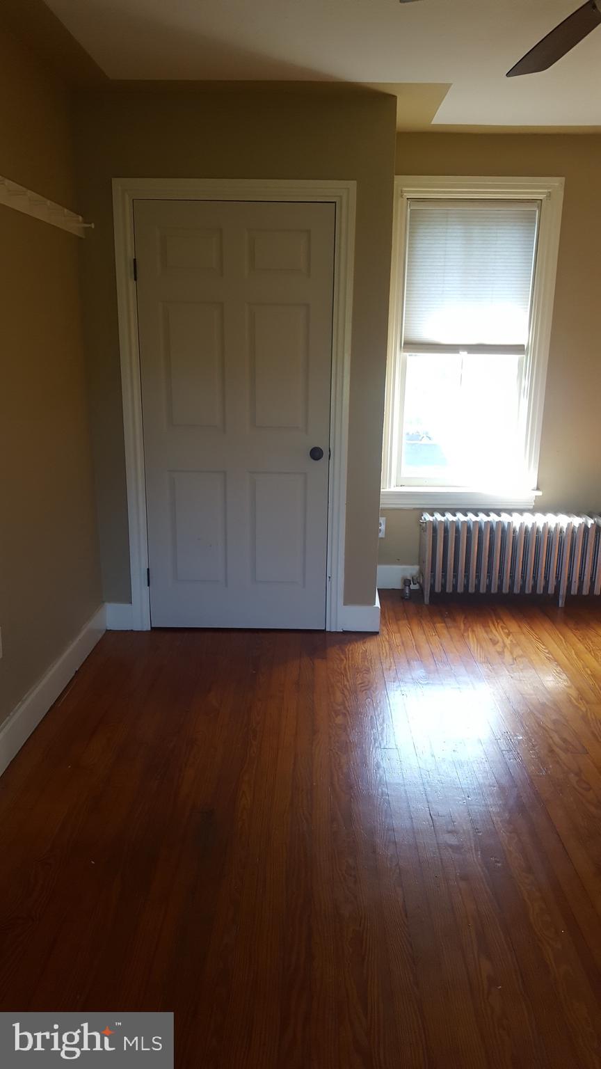2902 Lower Saucon Road, Unit A&B Hellertown, PA 18055 - Photo 26 of 53 an empty room with wooden floor and windows