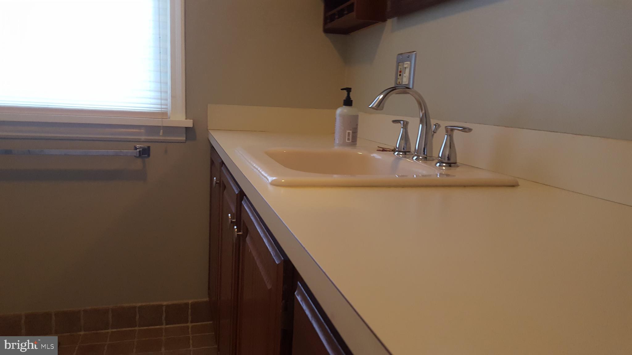 2902 Lower Saucon Road, Unit A&B Hellertown, PA 18055 - Photo 31 of 53 a bathroom with a sink and a mirror