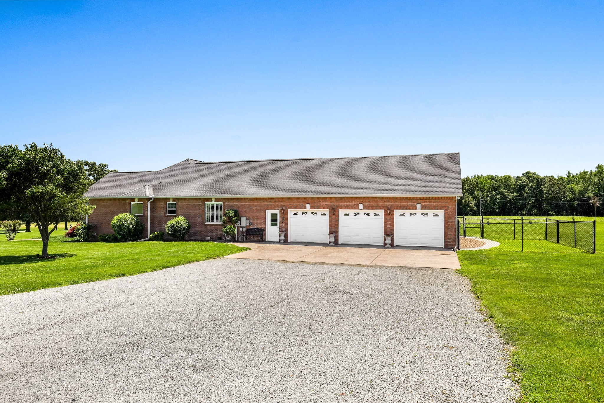 4984 Somerville Road Cross Plains, TN 37049 - Photo 19 of 57 a front view of a house with a yard and garage