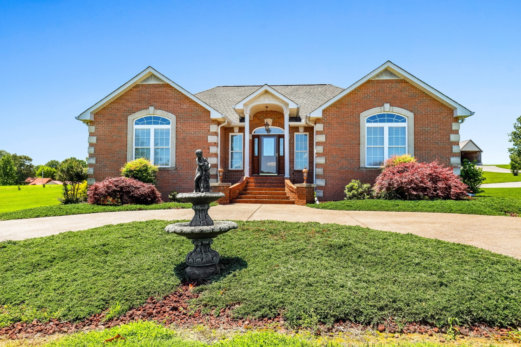 4984 Somerville Road Cross Plains, TN 37049 - Photo 2 of 57 a front view of house with yard and green space