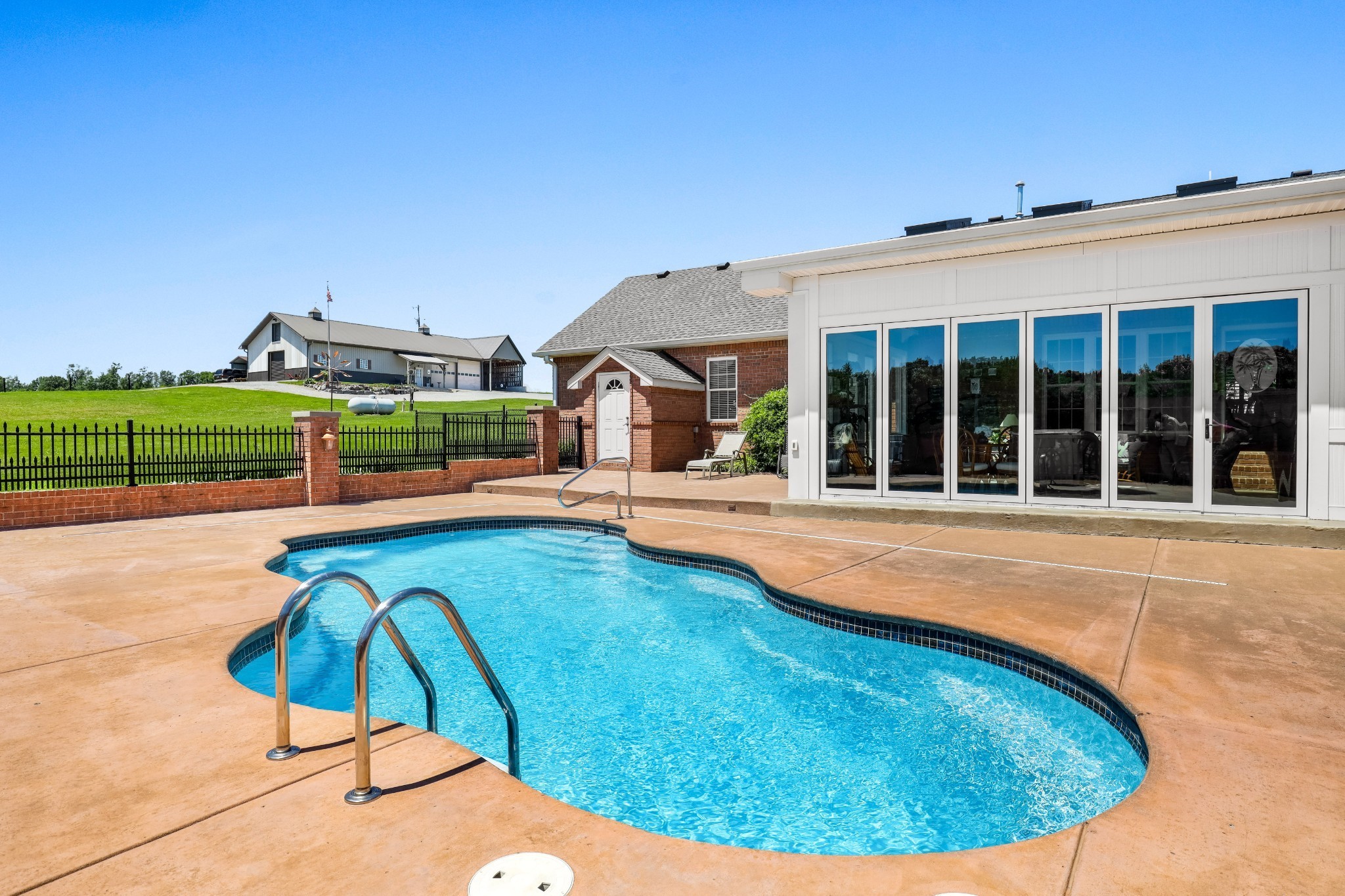 4984 Somerville Road Cross Plains, TN 37049 - Photo 22 of 57 a view of a swimming pool with a lounge chair
