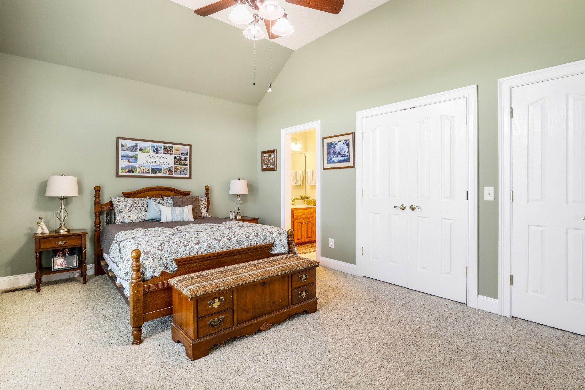 4984 Somerville Road Cross Plains, TN 37049 - Photo 51 of 57 a spacious bedroom with a bed and a chandelier