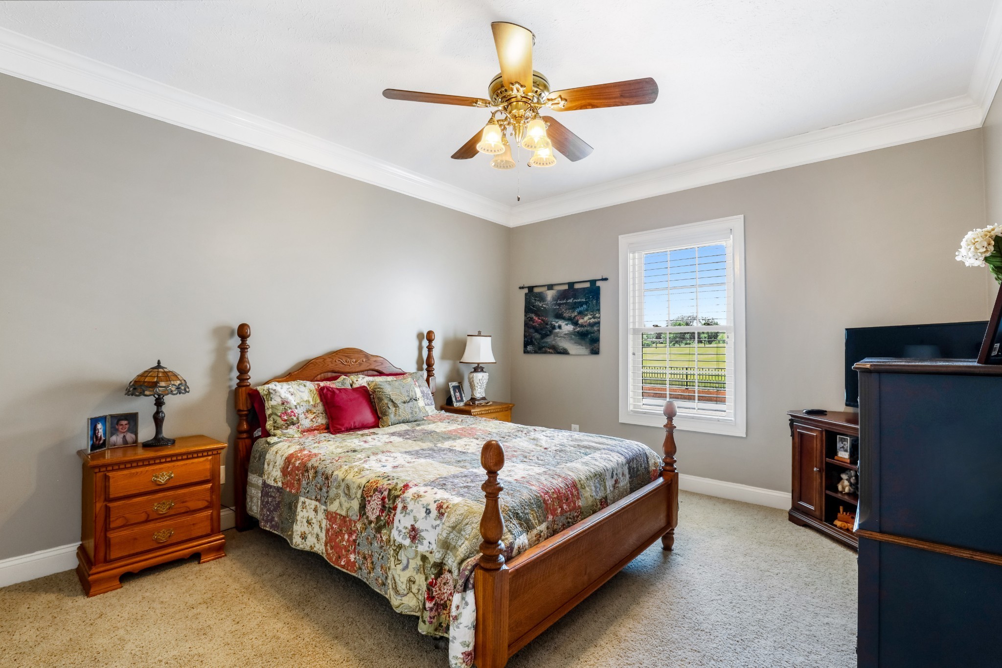 4984 Somerville Road Cross Plains, TN 37049 - Photo 54 of 57 a bedroom with a bed and a chandelier