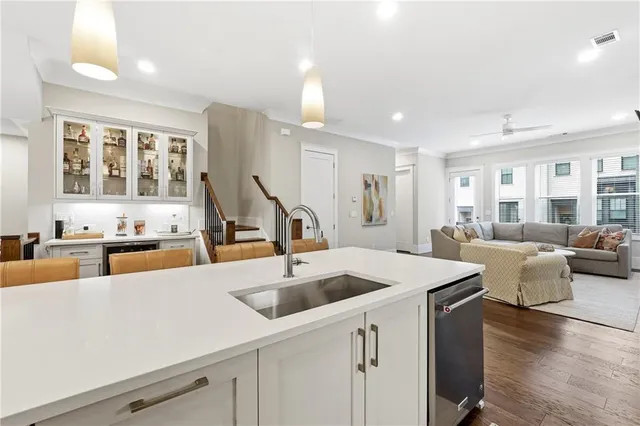 a view of kitchen island with stainless steel appliances
