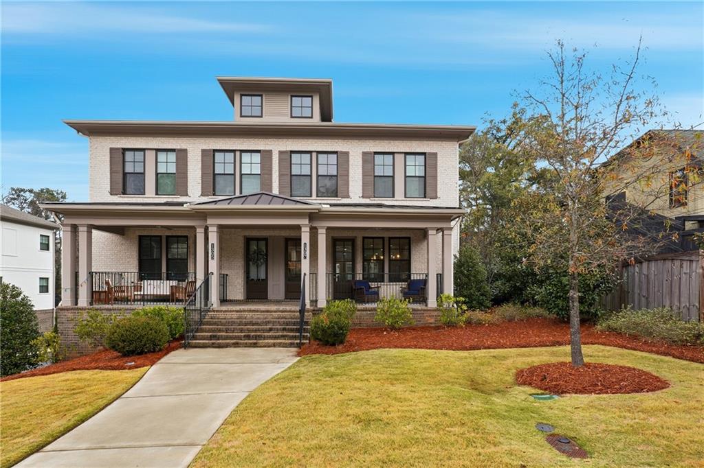 1307 Markham Road Atlanta, GA 30319 - Photo 2 of 47 a front view of a house with swimming pool