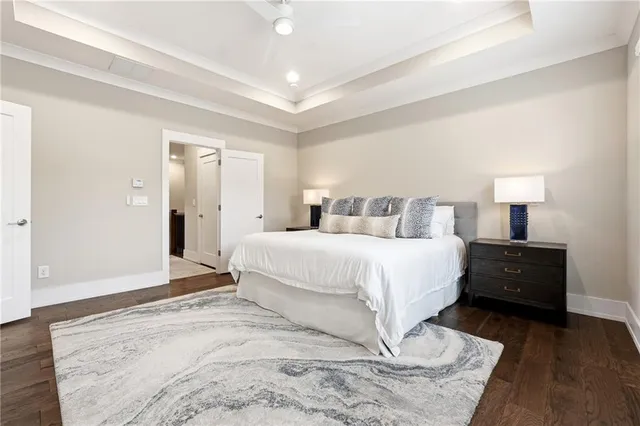 a bedroom with a bed and a night stand