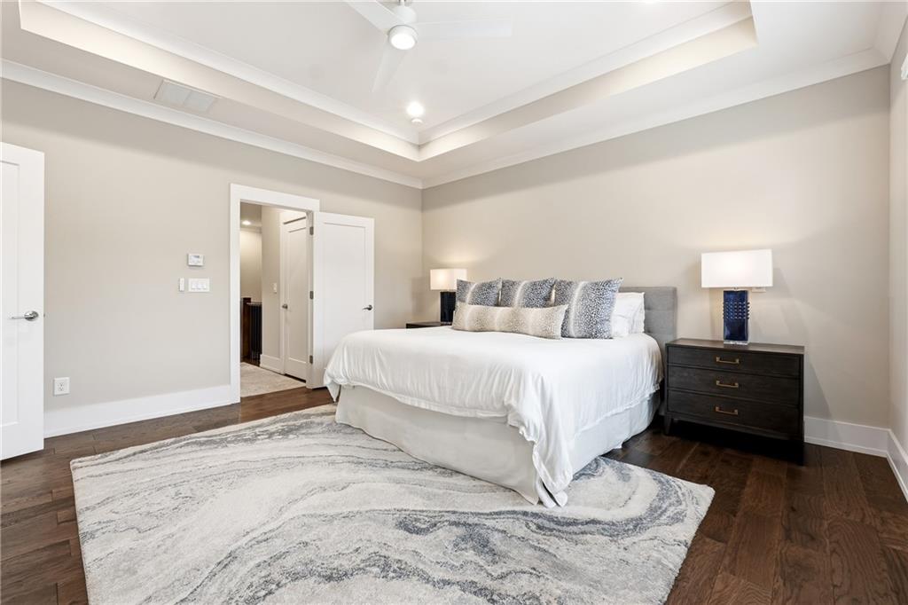 1307 Markham Road Atlanta, GA 30319 - Photo 24 of 47 a bedroom with a bed and a night stand