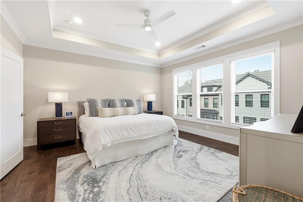 1307 Markham Road Atlanta, GA 30319 - Photo 25 of 47 a bedroom with a large bed and a large window