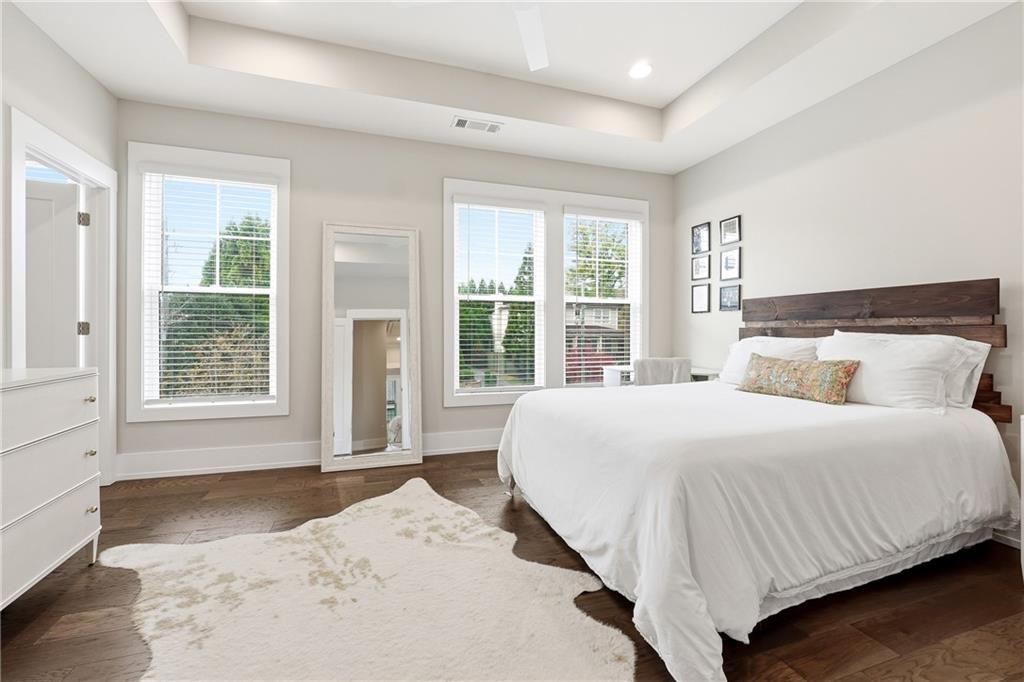 1307 Markham Road Atlanta, GA 30319 - Photo 29 of 47 a bedroom with a large bed and a large window