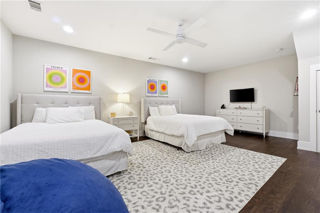 1307 Markham Road Atlanta, GA 30319 - Photo 35 of 47 a bedroom with a bed and dresser