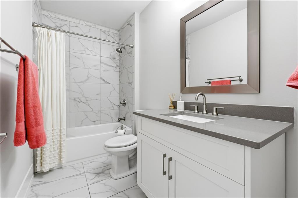 1307 Markham Road Atlanta, GA 30319 - Photo 36 of 47 a bathroom with a sink toilet and shower