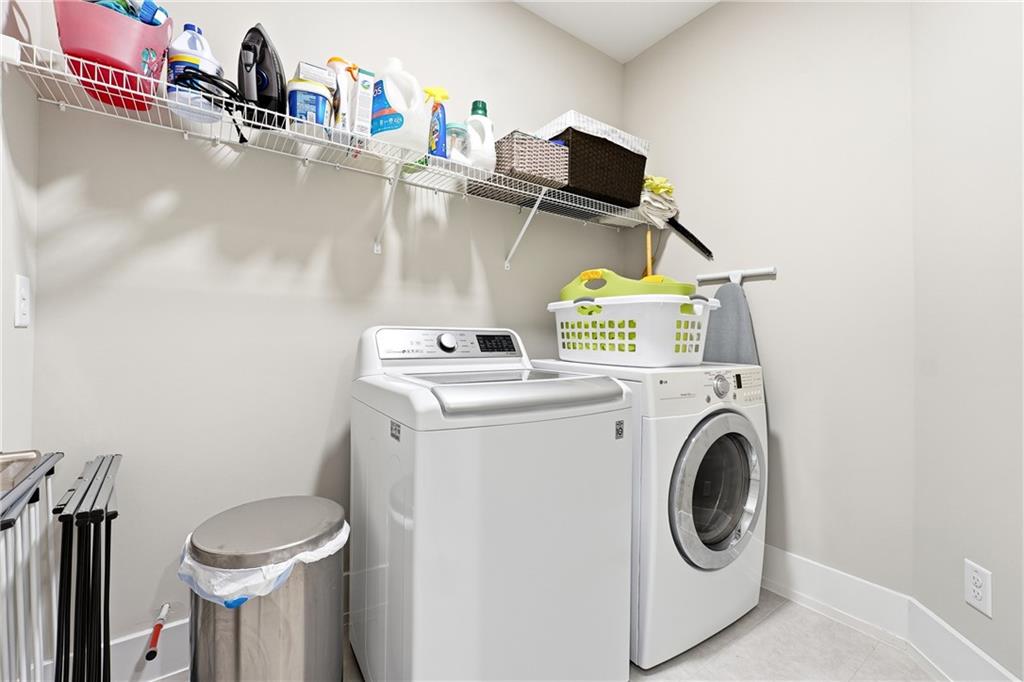 1307 Markham Road Atlanta, GA 30319 - Photo 37 of 47 a utility room with dryer and washer