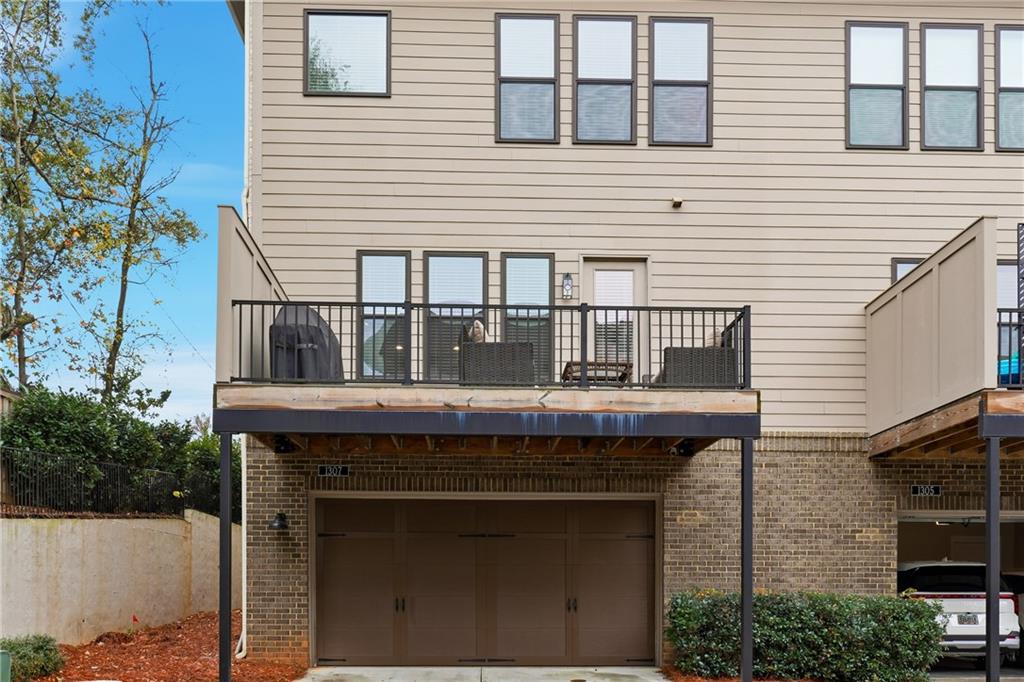 1307 Markham Road Atlanta, GA 30319 - Photo 39 of 47 a front view of a house with a garden