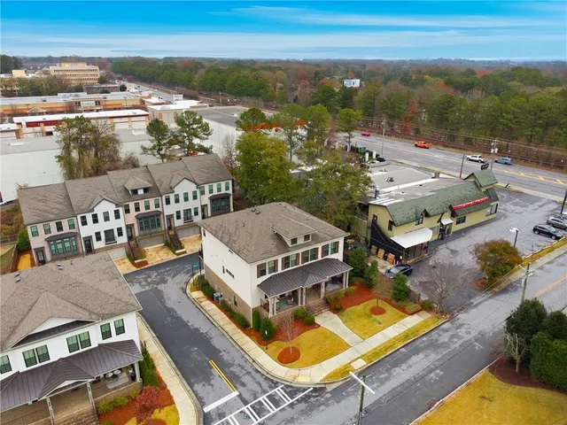 an aerial view of a house with a swimming pool