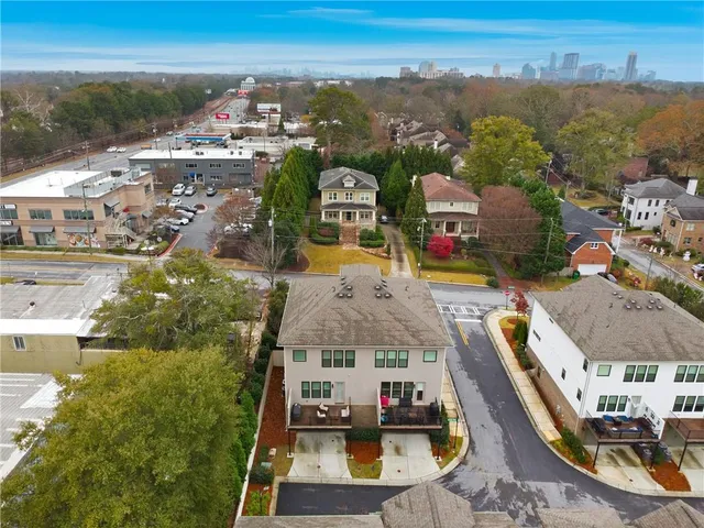 an aerial view of residential houses with outdoor space