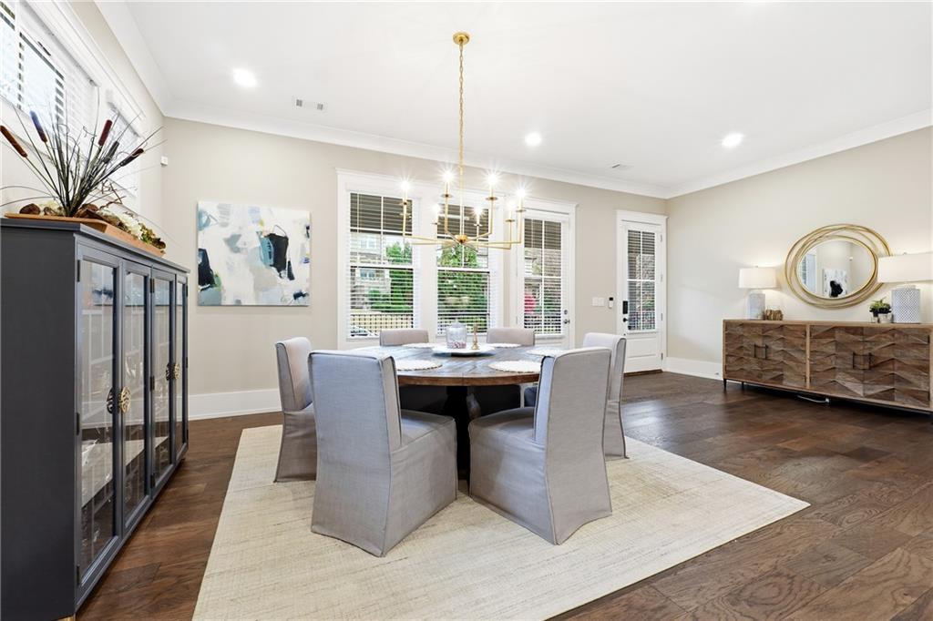 1307 Markham Road Atlanta, GA 30319 - Photo 8 of 47 a living room with furniture a table and large windows