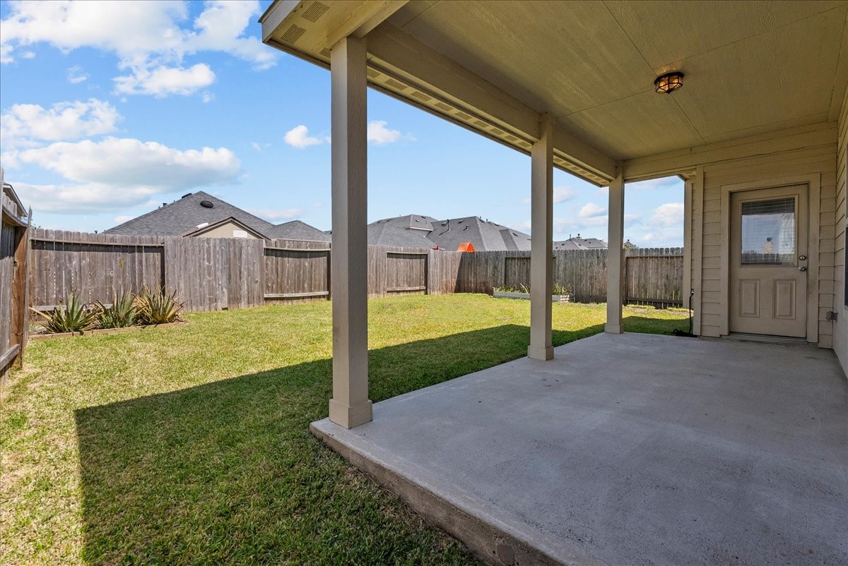 5111 Bay Lane Bacliff, TX 77518 - Photo 36 of 48 a view of a house with a big yard and large tree