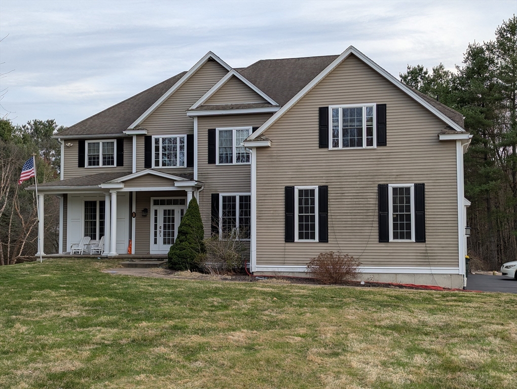 19 Plain Street Franklin, MA 02038 - Photo 1 of 1 a front view of a house with a yard