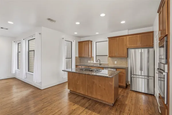 a utility room with sink dryer and washer