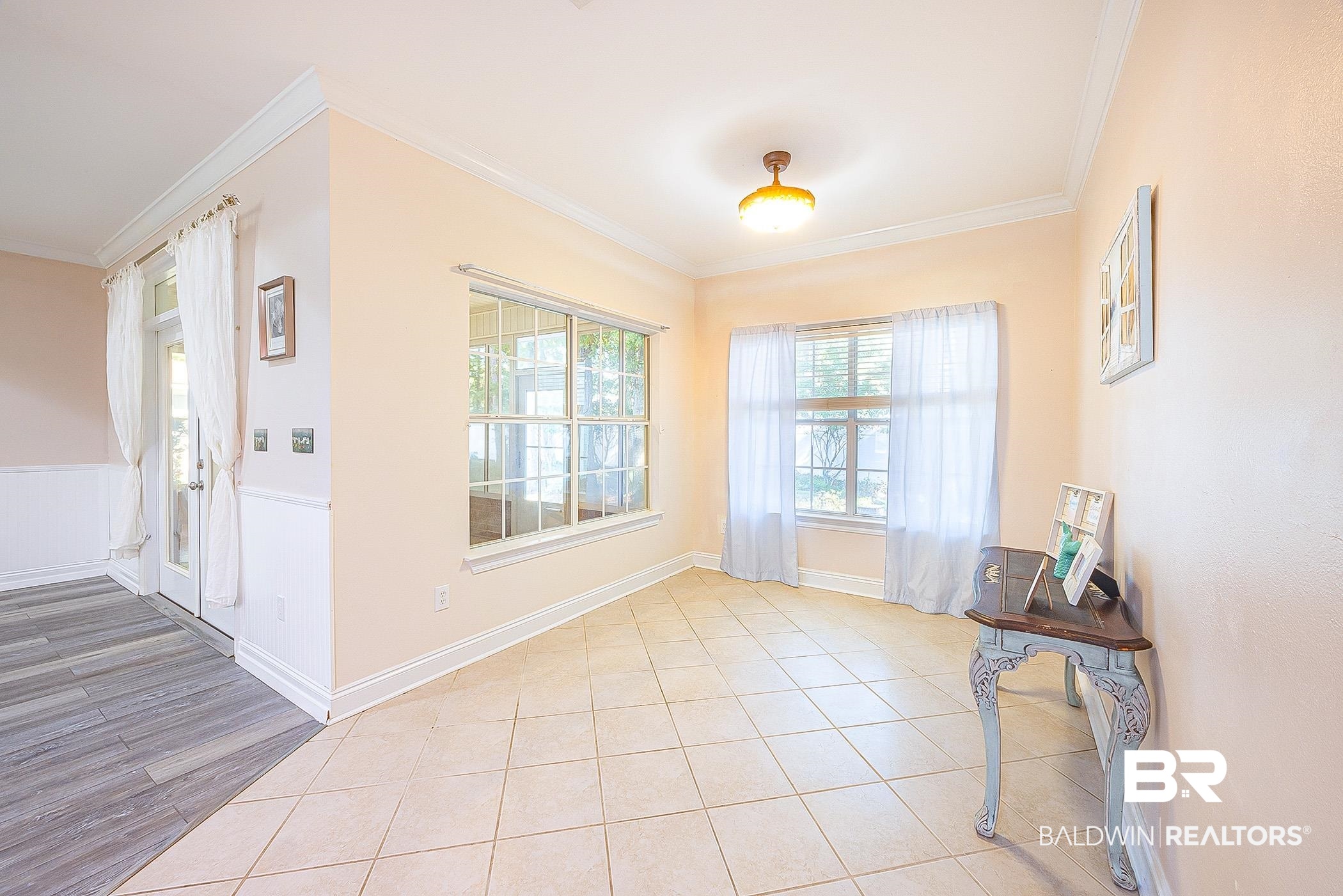 133 Mark Twain Loop Foley, AL 36535 - Photo 26 of 61 Entryway with crown molding and light tile patterned floors