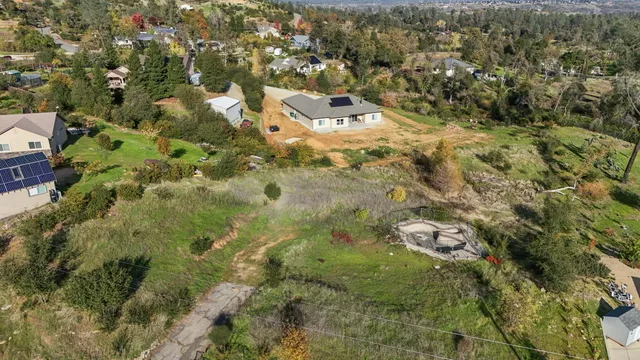 an aerial view of residential house with parking space