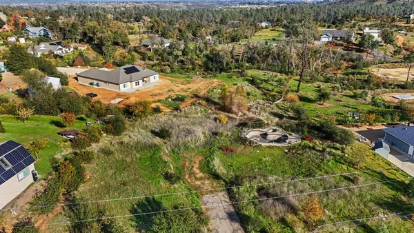 an aerial view of residential house with parking space