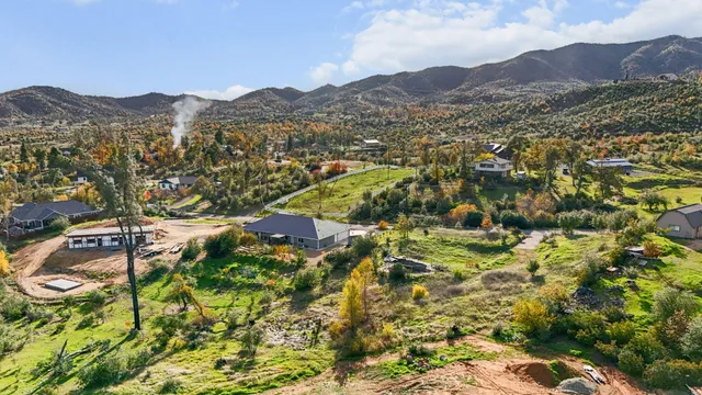 a view of a town with mountains in the background