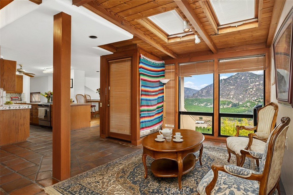 3264 Shearer Crossing Fallbrook, CA 92028 - Photo 13 of 41 a living room with furniture and a floor to ceiling window