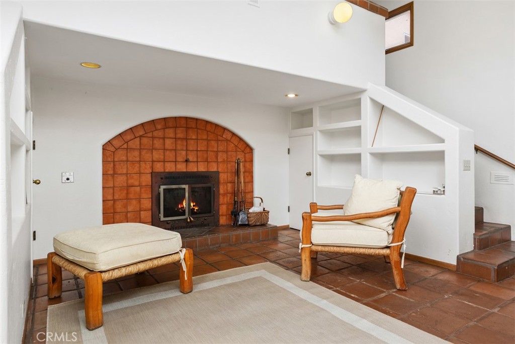 3264 Shearer Crossing Fallbrook, CA 92028 - Photo 15 of 41 a living room with furniture a fireplace and a table