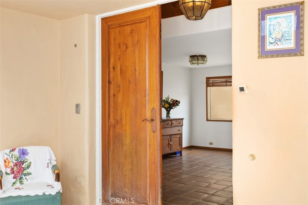 3264 Shearer Crossing Fallbrook, CA 92028 - Photo 5 of 41 a view of hallway with window and a bathroom