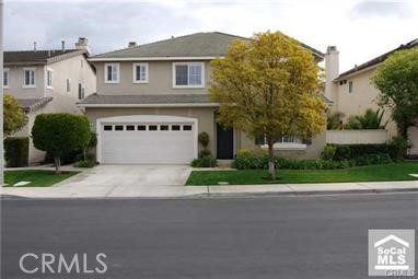 27 Pheasant Creek Irvine, CA 92618 - Photo 1 of 1 a front view of a house with a yard and garage