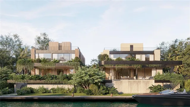 a front view of a house with a garden and lake view