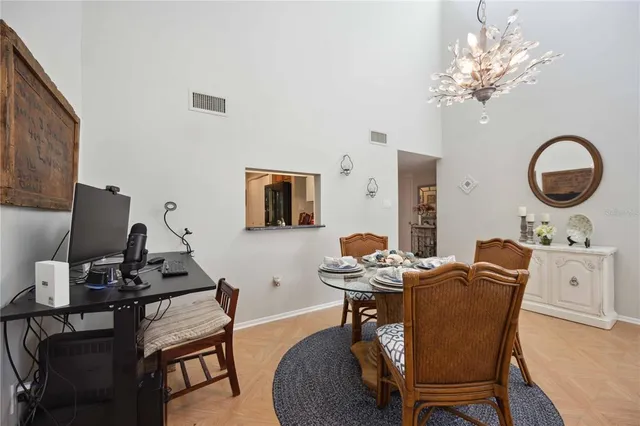 a kitchen with granite countertop a stove a sink and a refrigerator
