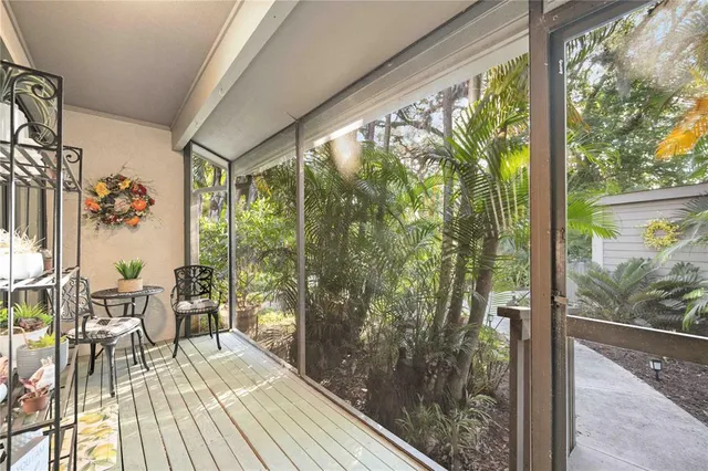 a bathroom with a granite countertop sink a large mirror and a glass door shower