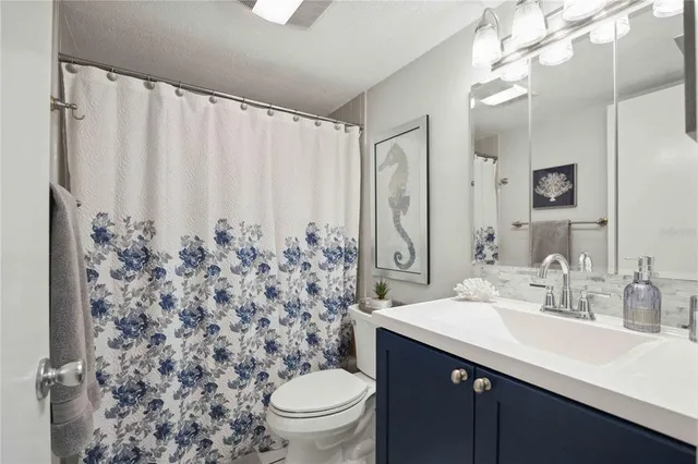 a kitchen with a sink and refrigerator