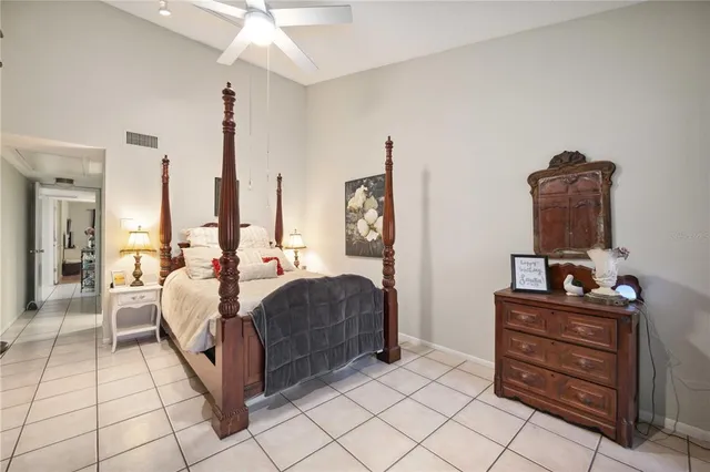 a bedroom with a bed dresser and a window