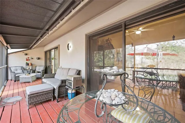 a view of a balcony with wooden floor