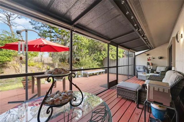 a view of a wooden deck with a patio