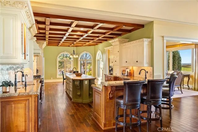a stove top oven sitting inside of a kitchen