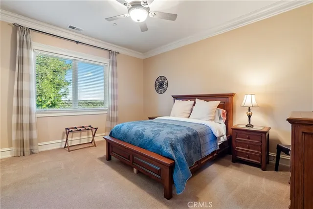 an aerial view of a house with a garden and lake view