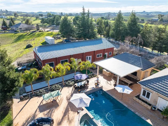 a view of a patio with dining table and chairs