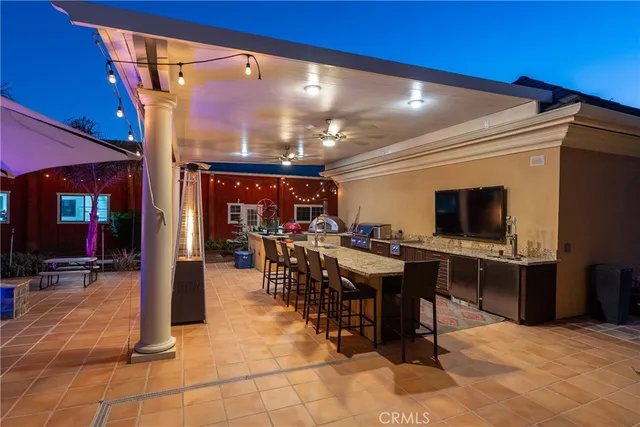 a view of a livingroom with workspace and a window