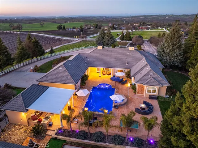 a front view of a house with sitting area