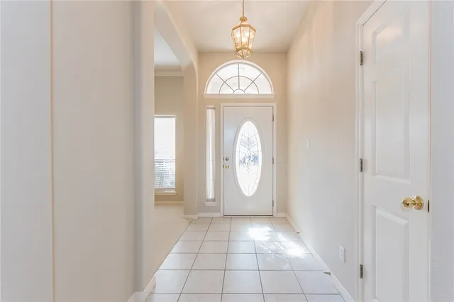 a view of a livingroom with wooden floor and window
